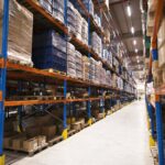 interior-large-distribution-warehouse-with-shelves-stacked-with-palettes-goods-ready-market-1-1-1.jpg